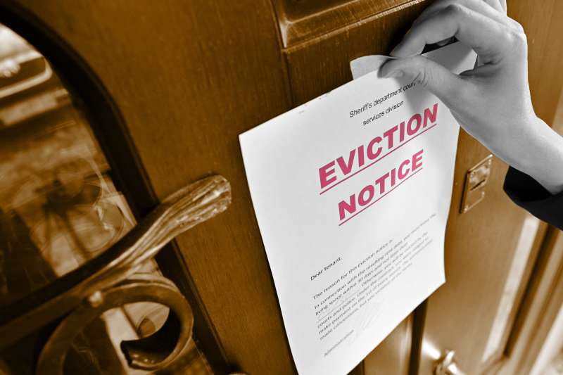 eviction notice  describes the building as "unfit for human habitation" and requests that they leave.